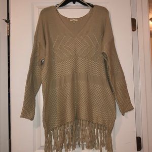Fringed oversized sweater.
